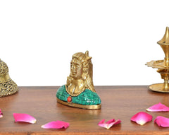 Brass Adiyogi Shiva idol side angle, green robe panel with red medallion