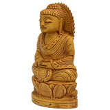 Carved wooden Buddha idol from side view, ornate halo and robe details