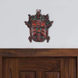 Brass Mahakala wall hanging mask, multicolored, front face with red and green accents
