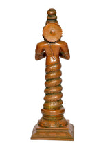 Brass Patanjali figurine, rear view showing rounded top ornament and patterned lower body.