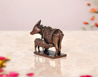 Copper cow and calf pooja mandir figurine, side view, ornate embossed saddle