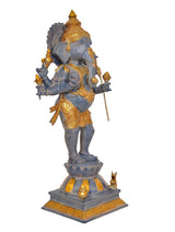 Side view of brass Lord Ganesha statue, six arms holding items, gold detailing
