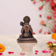 Copper Hanuman idol back-side view, seated posture with hand gesture, 2-inch