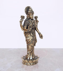 7-inch Lakshmi Laxmi brass standing idol, angled front view with jewelry details