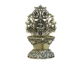 Ornate brass Laxmi oil lamp diya with detailed front, 4-inch height