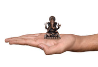 Ganesha copper idol held on open palm, small 2.5 inch religious statue
