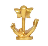 Gold-toned Ganesha idol statue, rear view with fan-like ears and seated base