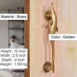 Golden brass door handle with dolphin and fish motif and round escutcheon