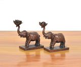 Copper elephant figurines set of 2 shown from the side, raised trunk and base