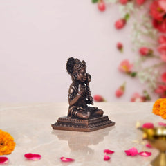 Copper Hanuman idol rear view, seated on decorated base, 2-inch height