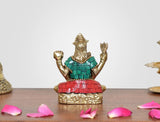 Brass Bholenath Lord sculpture, teal top with red belt, arms raised in meditation