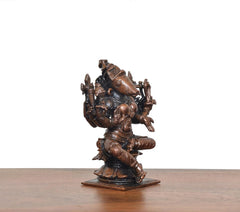Varahi figurine, rear angled view, eight arms posed, bronze-copper metal