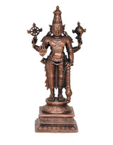 Copper Vishnu idol standing, front view with discus wheel and raised hands on pedestal