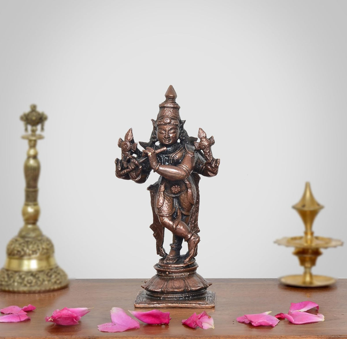 Copper Krishna flute statue playing flute, dark bronze finish, on square base
