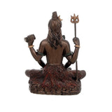 Back view of bronze Lord Shiva seated, holding trident and staff