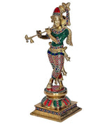 Messing-Krishnafigur, Vorderansicht: grünes Oberteil, rotes besticktes Hosenmuster