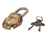 Tilted view of multicolor brass Buddha padlock and matching keys