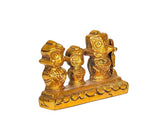Brass Jagannath Balram Subhadra figurines on platform, angled view