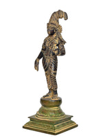 Brass Hindu goddess figurine with parrot, side view, detailed patterned attire
