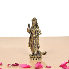 Standing brass Kartikeya murti angled view, raised hand gesture and lotus pedestal