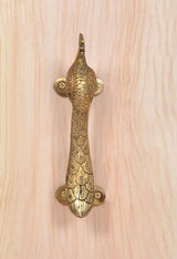 Gold brass peacock-shaped door handle with two screw points and textured scales