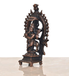 Copper Lord Krishna figurine with cow detail, side angle in arched frame