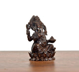 Lord Ganesha brass idol angled view, multi-armed pose with jewelry, lotus base