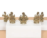 AONA brass Lakshmi idol set of 8, side view of eight seated statues