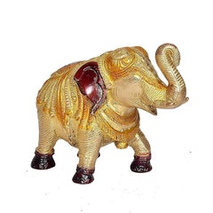 Golden brass elephant showpiece, rear/side view with swirled tail and red hooves