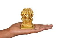 Brass Panchmukhi Ganesha idol in hand, gold-toned sculpture on base