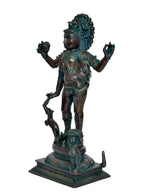 Shiva Bhikshatana statue, teal patina side view, raised hands and ornate headpiece