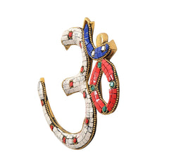 OM wall hanging sculpture, white mosaic segments with red, blue and green gem accents