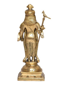 Golden brass Murugan figurine, back view with ornate headpiece and spear handle