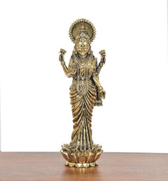 Brass Lakshmi standing idol with lotus base, raised hands and jeweled chest details