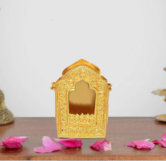 Gold-tone medium Tibetan Buddhist gau box with arched window and ornate embossed border