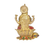 Back view of brass Lakshmi idol, jeweled green-and-red outfit on lotus base with small pot