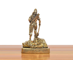 Brass Bhagawan Parashurama statue rear/side view, detailed clothing, on gold-tone base