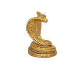 Brass coiled snake figurine for Shiva pooja, side view with textured base