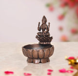 Copper Lakshmi Maa urli bowl, 3-inch height, lotus-carved sides with goddess on top.