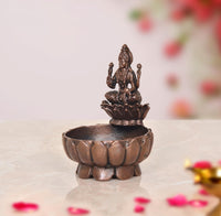 Copper Lakshmi Maa urli bowl, 3-inch height, lotus-carved sides with goddess on top.