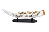 Resin seven running horse tusk display on clear stand with black base, white and gold accents.
