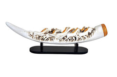 Resin seven running horse tusk display on clear stand with black base, white and gold accents.