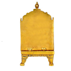 Brass chowki palki back view with carved base trim and decorative feet, 7 in