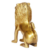 Brass lion idol statue, rear three-quarter view with curved tail and mane lines