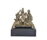 Brass Shiva Parivar family murti, seated center with Parvati and child figure on dark base