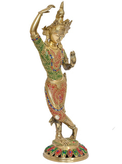Brass Tara Devi statue showing raised left hand and multicolor patterned dress