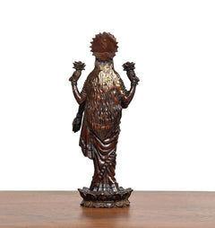 Lakshmi standing idol, back view with detailed draped clothing and crown ornament