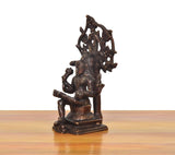 Brass Dakshinamurti Shiva murti side view, standing profile with halo frame