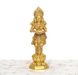 Golden brass Apsara lady figurine holding an oil lamp, single standing view