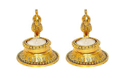 Two metal parrot diya lamps with upright birds, round candle cups, gold-tone finish